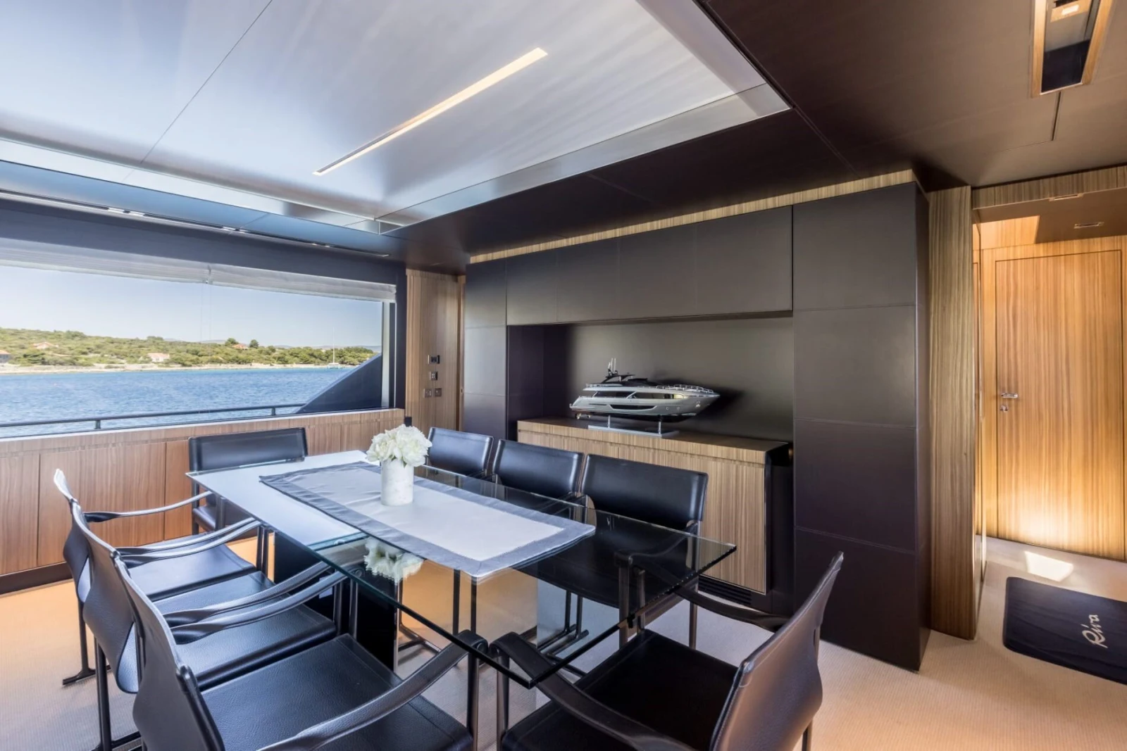 Dining area with panoramic windows aboard YOYITA II