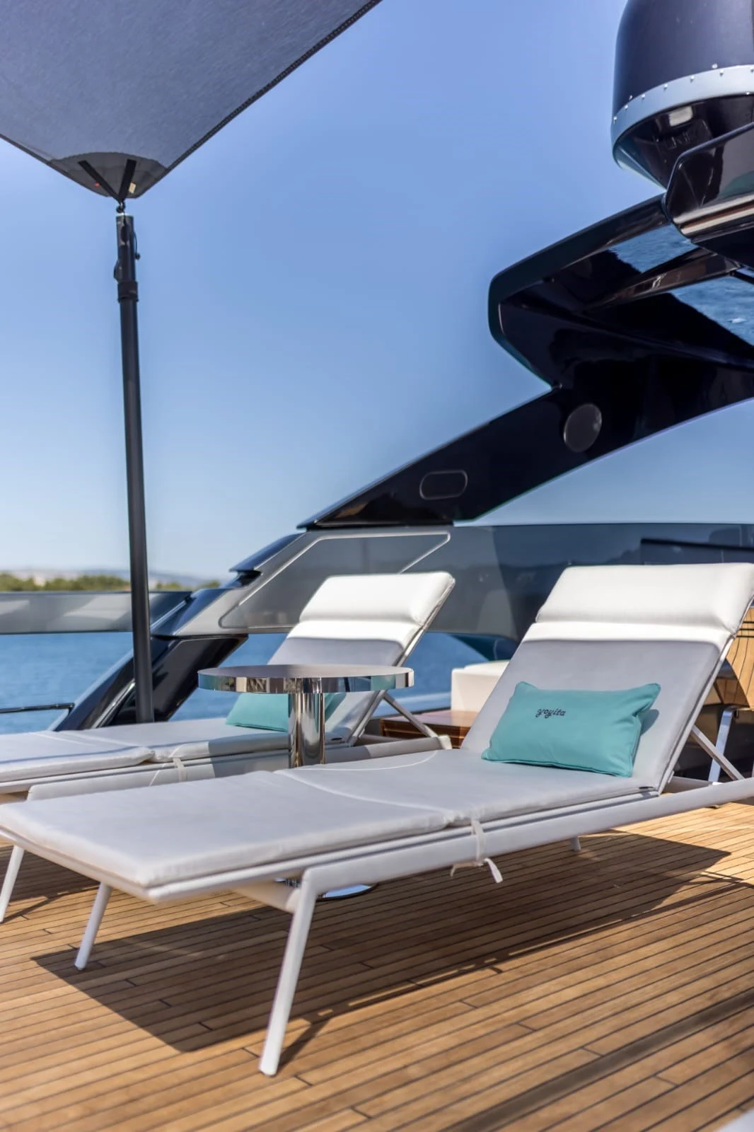 Upper-deck sun loungers aboard YOYITA II